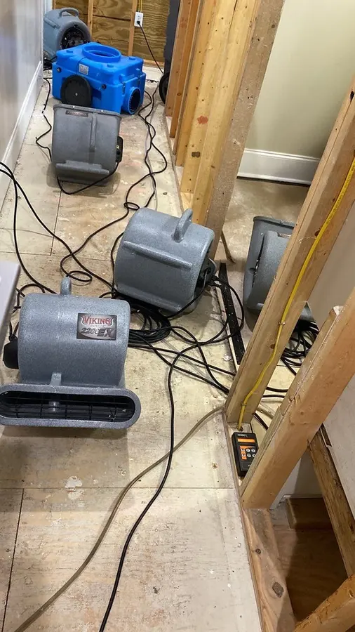 Drying equipment set in a room with the baseboards removed
